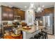 Spacious kitchen with granite countertops, stainless steel appliances, and an island at 10431 Machrihanish Cir, San Antonio, FL 33576
