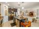 Modern kitchen with island and granite countertops at 10431 Machrihanish Cir, San Antonio, FL 33576