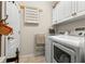 Bright laundry room with washer, dryer, and cabinets at 10431 Machrihanish Cir, San Antonio, FL 33576