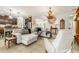 Open concept living room with kitchen views and comfortable seating at 10431 Machrihanish Cir, San Antonio, FL 33576