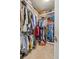 Large walk-in closet with ample hanging space and shelving at 10431 Machrihanish Cir, San Antonio, FL 33576