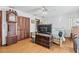 Bedroom with wood floors, built in closet and antique clock at 10836 Midland Bridge Rd, Hudson, FL 34667