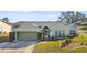 Charming single-story home with green garage door at 10836 Midland Bridge Rd, Hudson, FL 34667