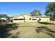 House exterior showcasing a large grassy backyard at 1360 Prescott S St, St Petersburg, FL 33712