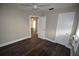 Bedroom with hardwood floors and access to hallway at 1360 Prescott S St, St Petersburg, FL 33712