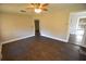 Living room with dark laminate floors and ceiling fan at 1360 Prescott S St, St Petersburg, FL 33712