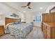 King-size bedroom with water views and wood dresser at 1750 Jamaica Way # 0234, Punta Gorda, FL 33950