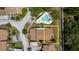 Aerial view of townhouse featuring backyard space, mature trees, and manicured landscaping at 1808 Cypress Trace Dr # 1808, Safety Harbor, FL 34695