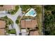 This aerial photo reveals a neighborhood pool and community featuring well-cared for landscaping around the homes at 1808 Cypress Trace Dr # 1808, Safety Harbor, FL 34695
