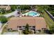 Aerial view of townhome community with pool, landscaping, and mature trees at 1808 Cypress Trace Dr # 1808, Safety Harbor, FL 34695