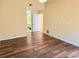 Primary bedroom with wood floors and en-suite bathroom at 1808 Cypress Trace Dr # 1808, Safety Harbor, FL 34695