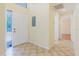 Bright entryway featuring tile floors, a solid front door with sidelight, and views into the home at 1808 Cypress Trace Dr # 1808, Safety Harbor, FL 34695