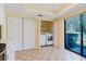 Laundry space featuring modern washer, dryer, closet and sliding glass door at 1808 Cypress Trace Dr # 1808, Safety Harbor, FL 34695
