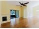 Spacious living room with hardwood floors, fireplace and sliding glass doors at 1808 Cypress Trace Dr # 1808, Safety Harbor, FL 34695