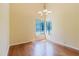 Bright living room with hardwood floors, large windows providing ample natural light, and a modern ceiling fan at 1808 Cypress Trace Dr # 1808, Safety Harbor, FL 34695