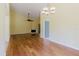 Bright and airy living room features hardwood floors, a fireplace, and contemporary lighting at 1808 Cypress Trace Dr # 1808, Safety Harbor, FL 34695