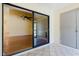 The tiled patio with sliding glass door access offers a view of the interior living room at 1808 Cypress Trace Dr # 1808, Safety Harbor, FL 34695