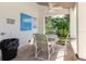 Relaxing covered outdoor seating area with a table and chairs, perfect for enjoying the outdoors at 1808 Cypress Trace Dr # 1808, Safety Harbor, FL 34695