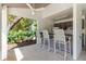 Community pool bar with seating, ceiling fan and mini fridge at 1808 Cypress Trace Dr # 1808, Safety Harbor, FL 34695