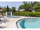 Community pool with separate spa area and handrails for easy access at 1808 Cypress Trace Dr # 1808, Safety Harbor, FL 34695