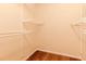 Walk-in closet featuring built-in metal racks for storage at 1808 Cypress Trace Dr # 1808, Safety Harbor, FL 34695