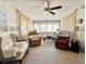 Living room with comfortable seating and large windows at 18675 Us Highway 19 N # 451, Clearwater, FL 33764