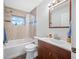 Bathroom featuring tiled shower, newer vanity, and functional fixtures at 1900 60Th N Way, St Petersburg, FL 33710