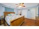 Spacious bedroom featuring hardwood floors, a ceiling fan, and a decorative bed frame at 1900 60Th N Way, St Petersburg, FL 33710