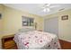 Bedroom features hardwood floors, a window with view, and a closet for storage at 1900 60Th N Way, St Petersburg, FL 33710