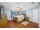 Bedroom featuring hardwood floors, natural light, and a ceiling fan at 1900 60Th N Way, St Petersburg, FL 33710