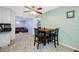 Cozy dining area featuring a small table, seating for four, and views into the living room at 1900 60Th N Way, St Petersburg, FL 33710