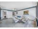Enclosed patio features comfortable seating, a ceiling fan, and natural light at 1900 60Th N Way, St Petersburg, FL 33710