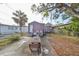 Backyard with patio, table, chairs, and storage shed at 2045 18Th S Ave, St Petersburg, FL 33712