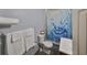 Clean bathroom with a shower/tub combo and blue shower curtain at 2045 18Th S Ave, St Petersburg, FL 33712