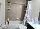 Clean bathroom with a shower/tub combo and tile surround at 2302 Maki Rd # 62, Plant City, FL 33563
