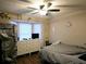 Bright bedroom with a ceiling fan, bay window, and dresser at 2302 Maki Rd # 62, Plant City, FL 33563
