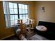 Bright bedroom with large window, cat tree, and futon at 2302 Maki Rd # 62, Plant City, FL 33563