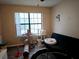 Bedroom featuring a large window, cat furniture, and futon at 2302 Maki Rd # 62, Plant City, FL 33563