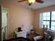 Second bedroom with a cat tree and large window at 2302 Maki Rd # 62, Plant City, FL 33563