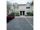 Front view of a two-story townhouse with parking at 2302 Maki Rd # 62, Plant City, FL 33563