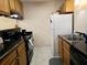 Efficient kitchen featuring granite countertops and wood cabinetry at 2302 Maki Rd # 62, Plant City, FL 33563