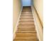 Wooden stairs leading to the upper level of the home at 2302 Maki Rd # 62, Plant City, FL 33563