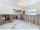 A bedroom under renovation, showing exposed framing and flooring at 4740 114Th N St, St Petersburg, FL 33708