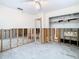 A bedroom undergoing renovation, showing exposed walls and flooring at 4740 114Th N St, St Petersburg, FL 33708