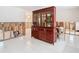 Dining room with a large wooden hutch and renovations in progress at 4740 114Th N St, St Petersburg, FL 33708