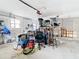 A cluttered garage with various items and storage racks at 4740 114Th N St, St Petersburg, FL 33708