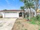 Front view of a single-story house with a white exterior at 4740 114Th N St, St Petersburg, FL 33708