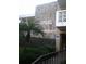 Exterior view of building 700 at 4910 Bay St NE, showing stone facade and landscaping at 4910 Bay Ne St # 309, St Petersburg, FL 33703