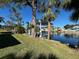 View of the canal and backyard with a boat lift at 5329 Richey Dr, New Port Richey, FL 34652