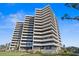 Modern high rise building exterior with water view at 5950 Pelican Bay S Plz # Ph-2D, St Petersburg, FL 33707